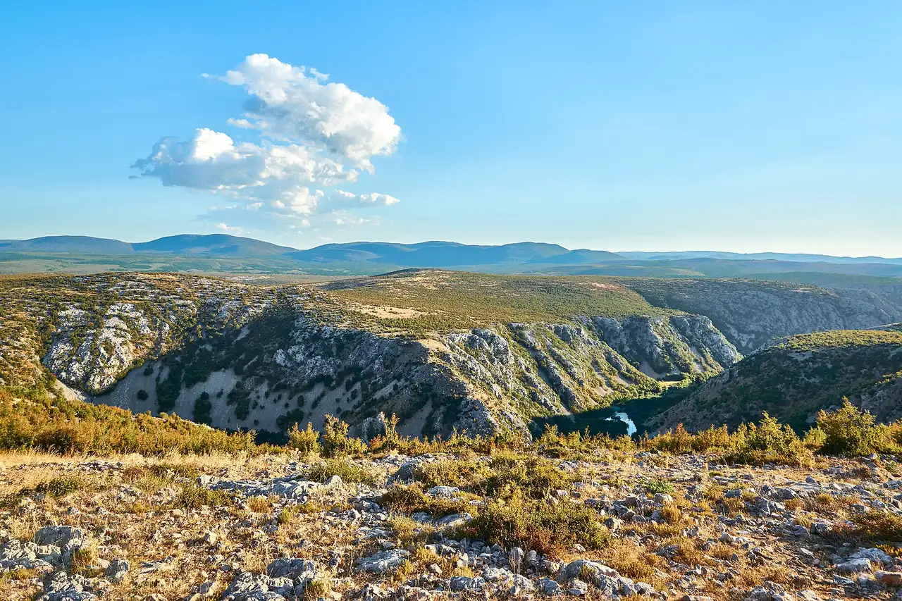 A white tufa terrace on a free-access Croatian river with no ticket booth in sight